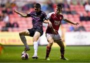 17 September 2021; Harry Groome of Wexford in action against Darragh Burns of St Patrick's Athletic during the extra.ie FAI Cup Quarter-Final match between St Patrick's Athletic and Wexford at Richmond Park in Dublin. Photo by Ben McShane/Sportsfile