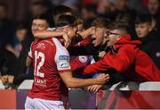 17 September 2021; Darragh Burns of St Patrick's Athletic celebrates after scoring his side's first goal with team-mate Matty Smith, 12, and the supporters during the extra.ie FAI Cup Quarter-Final match between St Patrick's Athletic and Wexford at Richmond Park in Dublin. Photo by Ben McShane/Sportsfile