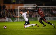 17 September 2021; Conor Delahunty of Maynooth University Town in action against Roland Idowu of Bohemians during the extra.ie FAI Cup Quarter-Final match between Bohemians and Maynooth University Town at Dalymount Park in Dublin. Photo by Stephen McCarthy/Sportsfile
