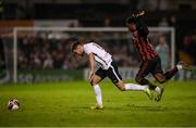 17 September 2021; Conor Delahunty of Maynooth University Town in action against Roland Idowu of Bohemians during the extra.ie FAI Cup Quarter-Final match between Bohemians and Maynooth University Town at Dalymount Park in Dublin. Photo by Stephen McCarthy/Sportsfile