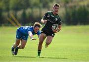 18 September 2021; Oran McNulty of Connacht evades the tackle of Leinster's Conor Gibney on his way to scoring his side's ninth try during the Development Interprovincial match between Leinster XV and Connacht XV at the IRFU High Performance Centre, on the Sport Ireland Campus in Dublin. Photo by Seb Daly/Sportsfile