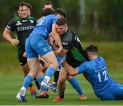 18 September 2021; Peter Sullivan of Connacht is tackled by Charlie Tector, left, and Ben Brownlee of Leinster during the Development Interprovincial match between Leinster XV and Connacht XV at the IRFU High Performance Centre, on the Sport Ireland Campus in Dublin. Photo by Seb Daly/Sportsfile
