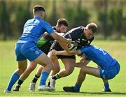 18 September 2021; Charlie Ward of Connacht is tackled by Ben Brownlee, left, and Conor Duggan of Leinster during the Development Interprovincial match between Leinster XV and Connacht XV at the IRFU High Performance Centre, on the Sport Ireland Campus in Dublin. Photo by Seb Daly/Sportsfile