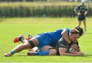 18 September 2021; Peter Sullivan of Connacht dives over to score his side's sixth try, despite the tackle of Leinster's Dylan Ryan, during the Development Interprovincial match between Leinster XV and Connacht XV at the IRFU High Performance Centre, on the Sport Ireland Campus in Dublin. Photo by Seb Daly/Sportsfile