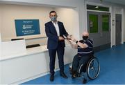 23 September 2021; Irish Wheelchair Association recently celebrated the refurbishment of the superb facilities in the Dr. Oliver Murphy Sports Centre, Clontarf, Dublin. The refurbishment was completed by charity partner John Paul Construction and gives the interior of the ground floor space a much-needed new look for the benefit of its many members and visitors. The work included the installation of a new reception area, new flooring and a paint upgrade of the interior area. With the facility serving many Irish Wheelchair Association members and the local community for a variety of activities including a full accessible and inclusive gym, a full-sized sports hall for a wide range of wheelchair sports and other sports clubs, the new look gives a warm welcome to everyone who visits. Construction Director of JPC John Moran, left, is presented a trophy by IWA Sport Board Membe Adrian O' Donoghue.  Photo by Harry Murphy/Sportsfile