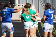19 September 2021; Kathryn Dane of Ireland, 9, celebrates with team-mate Beibhinn Parsons, hidden, after scoring a try during the Rugby World Cup 2022 Europe Qualifying Tournament match between Italy and Ireland at Stadio Sergio Lanfranchi in Parma, Italy. Photo by Roberto Bregani/Sportsfile
