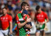 19 September 2021; Rapparees goalkeeper Anthony Larkin carries his son Keegan, age 5 and a half months, in the parade before the Wexford Senior County Hurling Championship Final match between St Anne's Rathangan and Rapparees at Chadwicks Wexford Park in Wexford. Photo by Piaras Ó Mídheach/Sportsfile