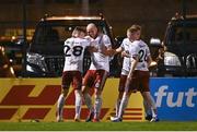 20 September 2021; Georgie Kelly of Bohemians, second left, celebrates with team-mate Dawson Devoy after scoring their side's third goal during the SSE Airtricity League Premier Division match between Bohemians and Derry City at Dalymount Park in Dublin. Photo by Seb Daly/Sportsfile