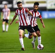 27 August 2021; Daniel Lafferty, left, and Bastien Hery of Derry City during the extra.ie FAI Cup Second Round match between Finn Harps and Derry City at Finn Park in Ballybofey, Donegal. Photo by Ramsey Cardy/Sportsfile