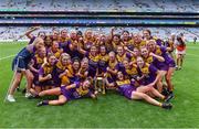 12 September 2021; Wexford players celebrate after their side's victory in the All-Ireland Premier Junior Camogie Championship Final match between Armagh and Wexford at Croke Park in Dublin. Photo by Piaras Ó Mídheach/Sportsfile