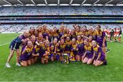 12 September 2021; Wexford players celebrate after their side's victory in the All-Ireland Premier Junior Camogie Championship Final match between Armagh and Wexford at Croke Park in Dublin. Photo by Piaras Ó Mídheach/Sportsfile