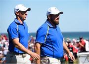 24 September 2021; Rory McIlroy, left, and Shane Lowry of Team Europe during their Friday afternoon fourballs match against Tony Finau and Harris English of Team USA at the Ryder Cup 2021 Matches at Whistling Straits in Kohler, Wisconsin, USA. Photo by Tom Russo/Sportsfile