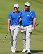 24 September 2021; Shane Lowry, right, and Rory McIlroy of Team Europe during their Friday afternoon fourballs match against Tony Finau and Harris English of Team USA at the Ryder Cup 2021 Matches at Whistling Straits in Kohler, Wisconsin, USA. Photo by Tom Russo/Sportsfile