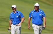 24 September 2021; Shane Lowry, right, and Rory McIlroy of Team Europe during their Friday afternoon fourballs match against Tony Finau and Harris English of Team USA at the Ryder Cup 2021 Matches at Whistling Straits in Kohler, Wisconsin, USA. Photo by Tom Russo/Sportsfile