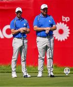 24 September 2021; Shane Lowry, right, and Rory McIlroy of Team Europe during their Friday afternoon fourballs match against Tony Finau and Harris English of Team USA at the Ryder Cup 2021 Matches at Whistling Straits in Kohler, Wisconsin, USA. Photo by Tom Russo/Sportsfile