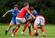 24 September 2021; Daniel Hawkshaw of Leinster is tackled by Jack Crowley of Munster during the Development Interprovincial match between Leinster XV and Munster XV at the IRFU High Performance Centre at the Sport Ireland Campus in Dublin. Photo by Brendan Moran/Sportsfile