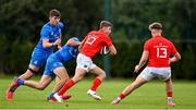 24 September 2021; Jack Crowley of Munster is tackled by Daniel Hawkshaw of Leinster during the Development Interprovincial match between Leinster XV and Munster XV at the IRFU High Performance Centre at the Sport Ireland Campus in Dublin. Photo by Brendan Moran/Sportsfile