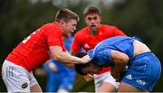 24 September 2021; Daniel Hawkshaw of Leinster is tackled by Patrick Campbell of Munster during the Development Interprovincial match between Leinster XV and Munster XV at the IRFU High Performance Centre at the Sport Ireland Campus in Dublin. Photo by Brendan Moran/Sportsfile