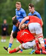 24 September 2021; Vakh Abdalaze of Leinster is tackled by Jack Daly and Paddy Kelly of Munster during the Development Interprovincial match between Leinster XV and Munster XV at the IRFU High Performance Centre at the Sport Ireland Campus in Dublin. Photo by Brendan Moran/Sportsfile