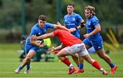 24 September 2021; Cormac Foley of Leinster is tackled by Scott Buckley of Munster during the Development Interprovincial match between Leinster XV and Munster XV at the IRFU High Performance Centre at the Sport Ireland Campus in Dublin. Photo by Brendan Moran/Sportsfile