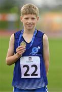 25 September 2021; Oisin Giles from Skyrne, Meath, with his gold medal after the Boys under-12 100 metre during the Aldi Community Games Track and Field Athletics finals at Carlow IT Sports Campus in Carlow. Photo by Matt Browne/Sportsfile