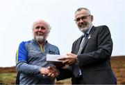 25 September 2021; Uachtarán Chumann Lúthchleas Gael Larry McCarthy, right, presents a gift to Martin Donnelly during the M. Donnelly GAA All-Ireland Poc Fada finals at Annaverna Mountain in the Cooley Peninsula, Ravensdale, Louth. Photo by Ben McShane/Sportsfile