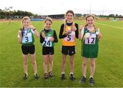 25 September 2021; Nicole Griffin, 5, from Ballynally-Lissycasey, Clare, who won the Girls under-10 200 metre with, from left, fourth place Sadbh Donnelly from Limerick, Holly Mcelarney from Mayo and Nicole Rigney from Carlow during the Aldi Community Games Track and Field Athletics finals at Carlow IT Sports Campus in Carlow. Photo by Matt Browne/Sportsfile