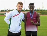 25 September 2021; Philip Finnan from Castledaly, Westmeath, after he won the Boys under-14 100 metre  with Irish 100 metre sprinter Marcus Lawler during the Aldi Community Games Track and Field Athletics finals at Carlow IT Sports Campus in Carlow. Photo by Matt Browne/Sportsfile