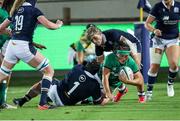 25 September 2021;  Lindsay Peat of Ireland is tackled by Leah Bartlett of Scotland   during the Rugby World Cup 2022 Europe qualifying tournament match between Ireland and Scotland at Stadio Sergio Lanfranchi in Parma, Italy. Photo by Roberto Bregani/Sportsfile