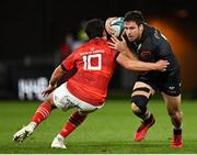 25 September 2021; Marius Louw of Cell C Sharks evades the tackle of Munster's Joey Carbery during the United Rugby Championship match between Munster and Cell C Sharks at Thomond Park in Limerick. Photo by Seb Daly/Sportsfile