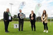 25 September 2021; Gerry McGuinness, President of the Community Games, and Jane Walsh make a presentation to Eimear Callan and Emma Callinon, Bus Eireann, during the Aldi Community Games Track and Field Athletics finals at Carlow IT Sports Campus in Carlow. Photo by Matt Browne/Sportsfile