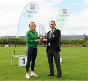 25 September 2021; Gerry McGuinness, President of the Community Games makes a presentation to Irish sprinter Sarah Quinn during the Aldi Community Games Track and Field Athletics finals at Carlow IT Sports Campus in Carlow. Photo by Matt Browne/Sportsfile