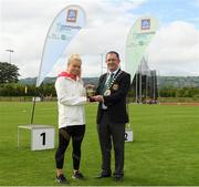 25 September 2021; Gerry McGuinness, President of the Community Games, makes a presentation to Irish sprinter Molly Scott during the Aldi Community Games Track and Field Athletics finals at Carlow IT Sports Campus in Carlow. Photo by Matt Browne/Sportsfile