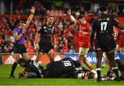 25 September 2021; Munster captain Peter O'Mahony, right, celebrates as referee Craig Evans awards a fifth try for his side, scored by team-mate Chris Cloete, during the United Rugby Championship match between Munster and Cell C Sharks at Thomond Park in Limerick. Photo by Seb Daly/Sportsfile