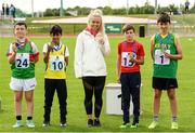 25 September 2021; Ireland sprinters Molly Scott, with, from left, under-12 ball throw medalists, fourth place Ryan McCormack from Mayo, third place Amer Almulhem from Roscommon, first place Sam Kingston from Skibereen, Cork, and second place Kevin O'Shea from Kerry during the Aldi Community Games Track and Field Athletics finals at Carlow IT Sports Campus in Carlow. Photo by Matt Browne/Sportsfile