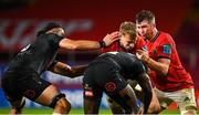 25 September 2021; Mike Haley of Munster is tackled by Yaw Penxe, centre, and Gerbrandt Grobler of Cell C Sharks during the United Rugby Championship match between Munster and Cell C Sharks at Thomond Park in Limerick. Photo by Seb Daly/Sportsfile