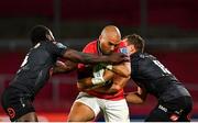 25 September 2021; Simon Zebo of Munster is tackled by Yaw Penxe, left, and Curwin Bosch of Cell C Sharks during the United Rugby Championship match between Munster and Cell C Sharks at Thomond Park in Limerick. Photo by Seb Daly/Sportsfile