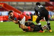 25 September 2021; Rowan Osborne of Munster is tackled by Phepsi Buthelezi of Cell C Sharks during the United Rugby Championship match between Munster and Cell C Sharks at Thomond Park in Limerick. Photo by Seb Daly/Sportsfile