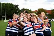 26 September 2021; Joanna Mahon of Blackrock College takes a selfie with team-mates and the trophy after the Bank of Ireland Paul Flood cup final match between Blackrock College RFC J1 and Old Belvedere RFC J1 at Old Belvedere RFC in Anglesea Road, Dublin. Photo by Harry Murphy/Sportsfile