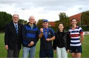 26 September 2021; Blackrock College club secretary Dave Brennan is presented with a pennant by, from left, President of Leinster Rugby John Walsh, Brian Flood, brother of Paul Flood, Jenny Flood, niece of Paul Flood, and Blackrock College captain Valerie Power after the Bank of Ireland Paul Flood cup final match between Blackrock College RFC J1 and Old Belvedere RFC J1 at Old Belvedere RFC in Anglesea Road, Dublin. Photo by Harry Murphy/Sportsfile