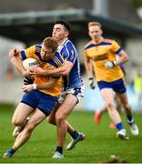 26 September 2021; Aaron Byrne of Na Fianna is tackled by Colm Basquel of Ballyboden St Enda's during the Go Ahead Dublin Senior Club Football Championship Group 1 match between Ballyboden St Endas and Na Fianna at Parnell Park in Dublin. Photo by David Fitzgerald/Sportsfile
