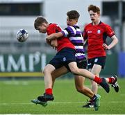 27 September 2021; Niall Cox of CUS is tackled by Paddy Curry of Terenure College during the Bank of Ireland Leinster Schools Junior Cup Round 1 match between CUS and Terenure College at Energia Park in Dublin. Photo by Eóin Noonan/Sportsfile