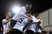 27 September 2021; Sam Stanton, hidden, celebrates after scoring his side's first goal with his Dundalk team-mates, including Sami Ben Amar, top, during the SSE Airtricity League Premier Division match between Dundalk and Bohemians at Oriel Park in Dundalk, Louth. Photo by Ben McShane/Sportsfile