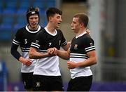 29 September 2021; Patrick Taylor of Newbridge College, right, celebrates after scoring his side's ninth try with team-mates Ruairí Munnelly and Conor Hanly during the Bank of Ireland Leinster Schools Junior Cup Round 1 match between Newbridge College and Presentation College Bray at Energia Park in Dublin. Photo by Harry Murphy/Sportsfile