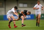 29 September 2021; Patrick Taylor of Newbridge College evades the tackle of James McGoldrick of Presentation College Bray during the Bank of Ireland Leinster Schools Junior Cup Round 1 match between Newbridge College and Presentation College Bray at Energia Park in Dublin. Photo by Harry Murphy/Sportsfile