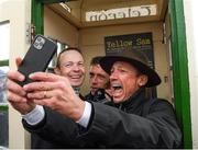 30 September 2021; Jockey Frankie Dettori, with fellow jockeys Jamie Spencer, left, and Shane Kelly, takes a selfie in the famous Barney Curley phone box, associated with the Yellow Sam coup in 1975, before the Gannon City Recovery and Recycling Services Ltd supporting DAFA handicap at Bellewstown Racecourse in Collierstown, Meath. Photo by Matt Browne/Sportsfile