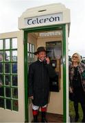 30 September 2021; Jockey Frankie Dettori, with the hat of the late trainer Barney Curley in the famous phone box, associated with the Yellow Sam coup in 1975, before the Gannon City Recovery and Recycling Services Ltd supporting DAFA handicap at Bellewstown Racecourse in Collierstown, Meath. Photo by Matt Browne/Sportsfile