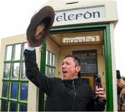 30 September 2021; Jockey Frankie Dettori, with the hat of the late trainer Barney Curley in the famous phone box, associated with the Yellow Sam coup in 1975, before the Gannon City Recovery and Recycling Services Ltd supporting DAFA handicap at Bellewstown Racecourse in Collierstown, Meath. Photo by Matt Browne/Sportsfile