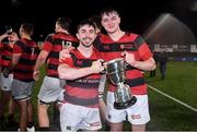 1 October 2021; Dublin University FC players Oisin Mangan, left, and Matt Jungman with the cup after their victory in the Metropolitan Cup Final match between Dublin University FC and Terenure College at Energia Park in Dublin. Photo by Ben McShane/Sportsfile