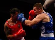 2 October 2021; Jack Marley of Monkstown Boxing Club, Dublin, right, and Marcin Skalski of Athlone Boxing Club, Westmeath, during their 92kg bout at the IABA National Elite Boxing Championships Finals in the National Stadium in Dublin. Photo by Seb Daly/Sportsfile